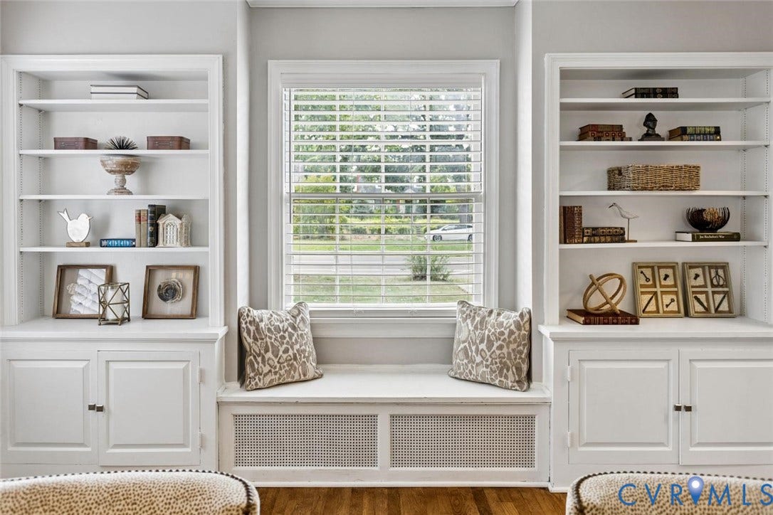 1316 Brookland Parkway, Richmond, VA 23227 Built-in shelving flanking a window with blinds, featuring a window seat and integrated storage