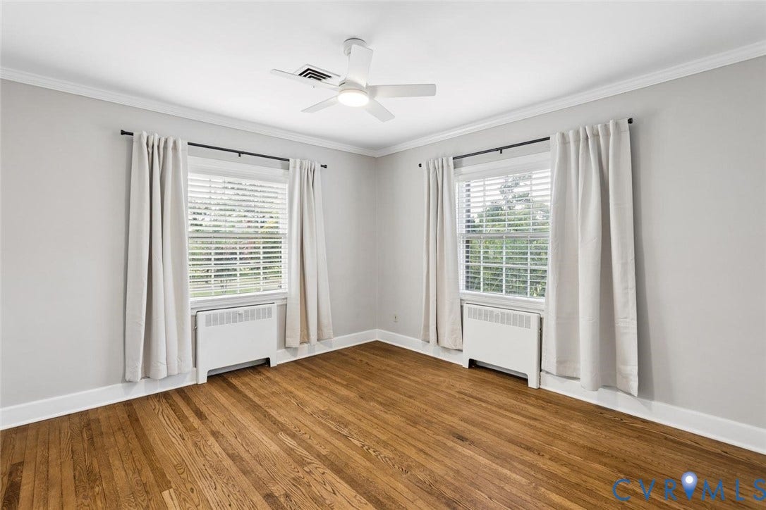 1316 Brookland Parkway, Richmond, VA 23227 Hardwood flooring, crown molding, two windows with blinds, and a ceiling fan with integrated lighting