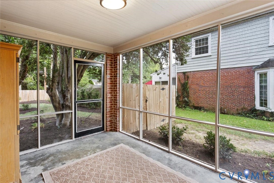 1316 Brookland Parkway, Richmond, VA 23227 Screened porch with a concrete floor, beadboard ceiling, and brick accent wall