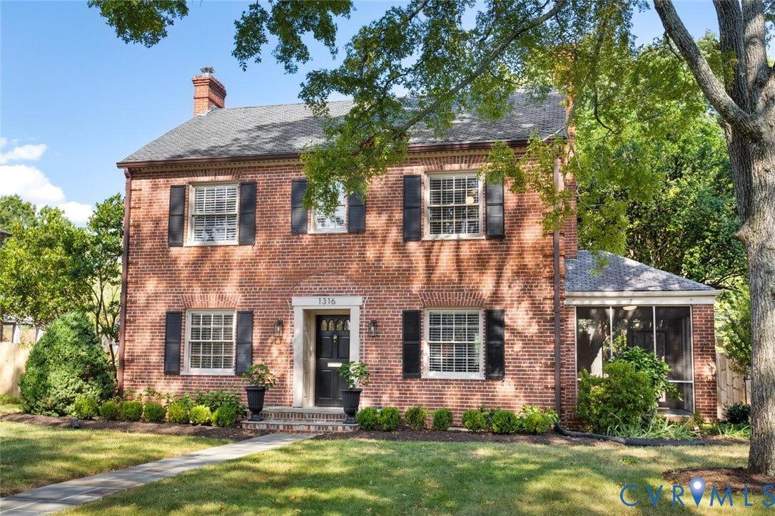 1316 Brookland Parkway, Richmond, VA 23227 Brick exterior featuring a screened porch, prominent chimney, mature trees, and a manicured lawn