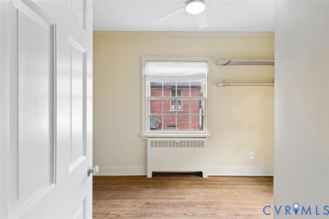 1316 Brookland Parkway, Richmond, VA 23227 Hardwood flooring, ceiling fan, window with privacy shade, built-in shelving, and radiator heating