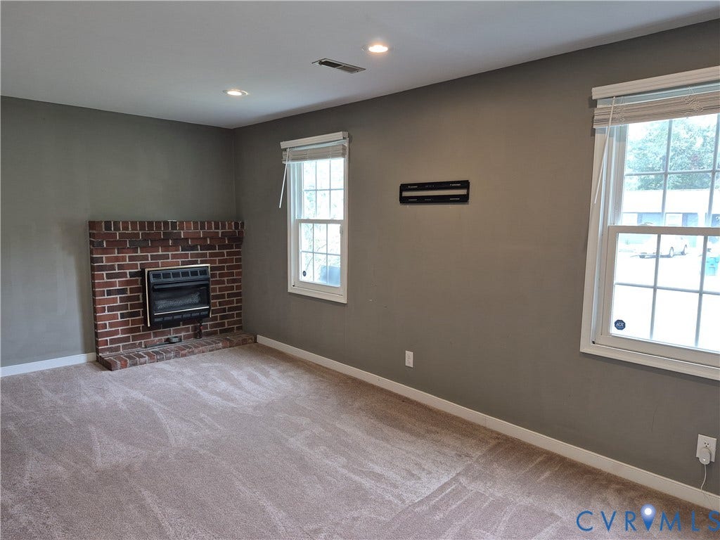 9324 Shiloh Drive, Chesterfield, VA 23237 Wall-to-wall carpeting, recessed ceiling lighting, and a brick fireplace