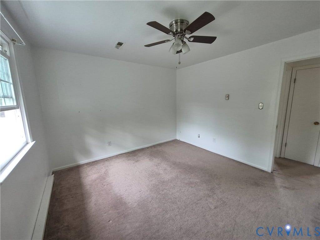 9324 Shiloh Drive, Chesterfield, VA 23237 White-painted room featuring a ceiling fan with light kit, a window, and carpet flooring