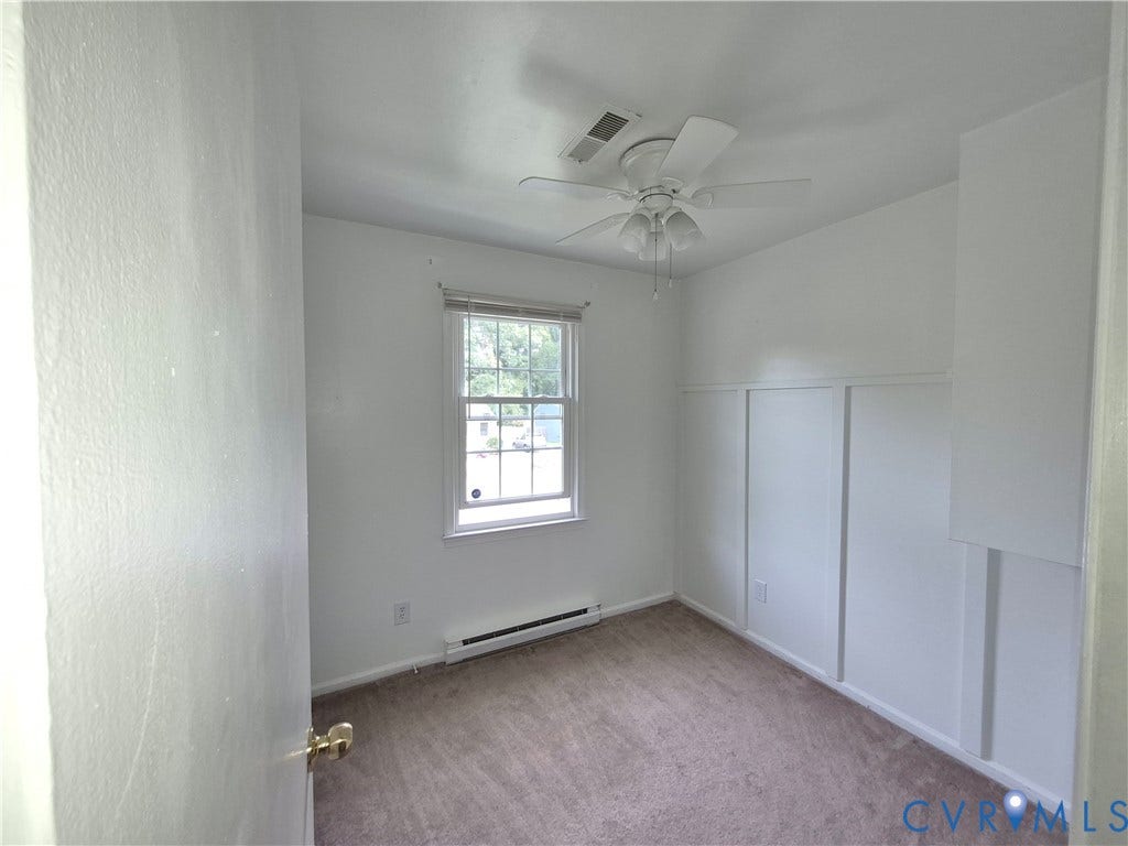 9324 Shiloh Drive, Chesterfield, VA 23237 Neutral wall finishes, window with blinds, ceiling fan, carpeted flooring, and sliding closet doors