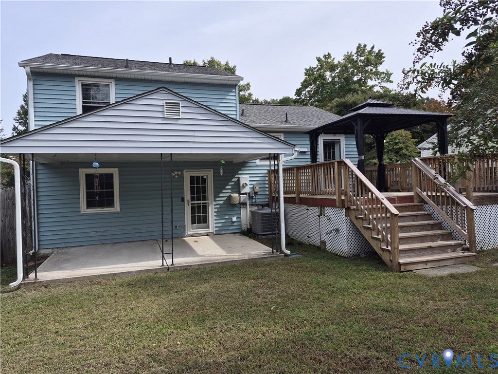 9324 Shiloh Drive, Chesterfield, VA 23237 Expansive rear exterior featuring blue siding, a multi-level wood deck, an attached covered patio, and a standalone gazebo