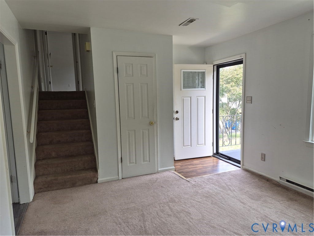 9324 Shiloh Drive, Chesterfield, VA 23237 Front entry with wood-finish flooring and security screen door