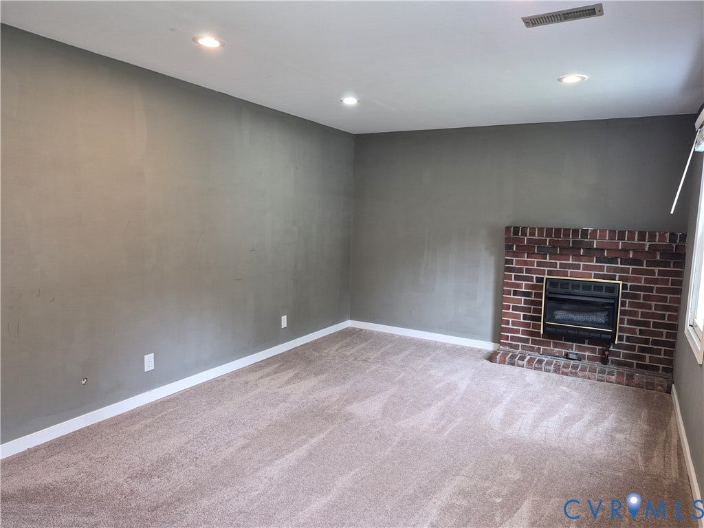 9324 Shiloh Drive, Chesterfield, VA 23237 Recessed lighting, brick fireplace with gas insert, light-toned carpet, and neutral wall paint