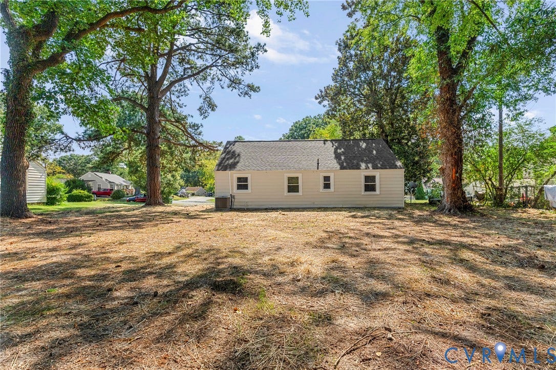 7406 Alycia Avenue, Henrico, VA 23228 Expansive rear yard featuring mature trees and a detached shed