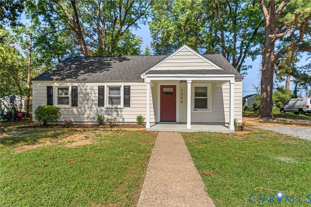 7406 Alycia Avenue, Henrico, VA 23228 Traditional exterior with light-colored siding, dark shingle roof, and a covered front porch with white columns