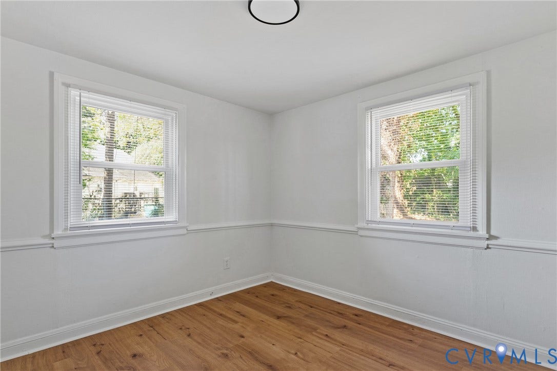 7406 Alycia Avenue, Henrico, VA 23228 Wood-finish flooring, white walls, two double-hung windows, and a ceiling-mounted light fixture
