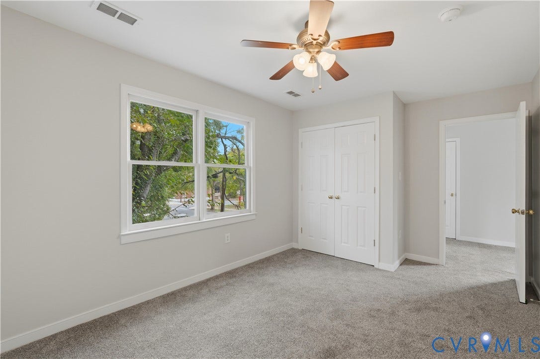 124 Lipscomb Street, Blackwell, Richmond, VA 23224 Plush carpet flooring, double-pane window, ceiling fan with light fixture, and bi-fold closet doors