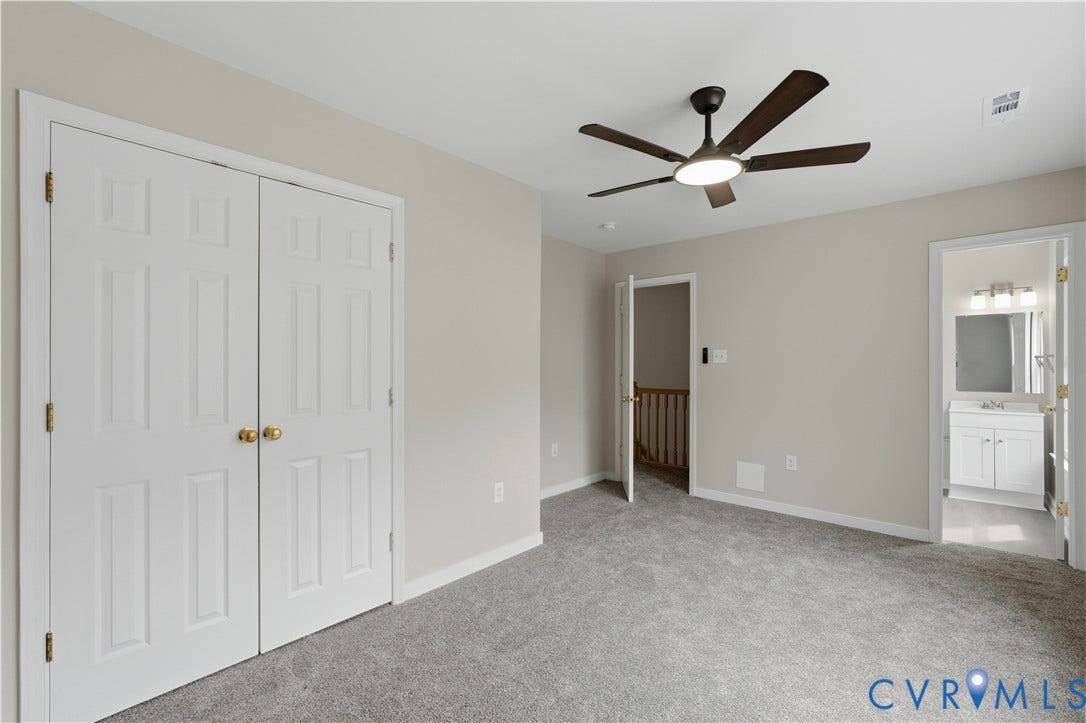 124 Lipscomb Street, Blackwell, Richmond, VA 23224 Plush gray carpeting, a modern ceiling fan with integrated lighting, and neutral wall tones