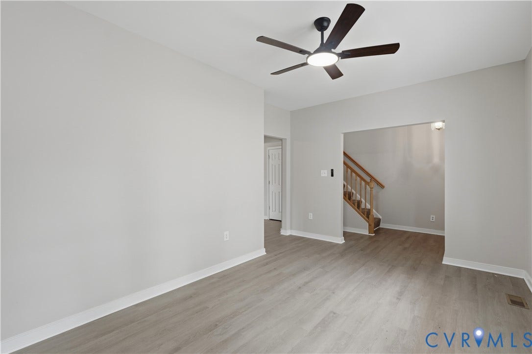 124 Lipscomb Street, Blackwell, Richmond, VA 23224 Light wood-finish flooring throughout, complemented by a modern ceiling fan with integrated lighting