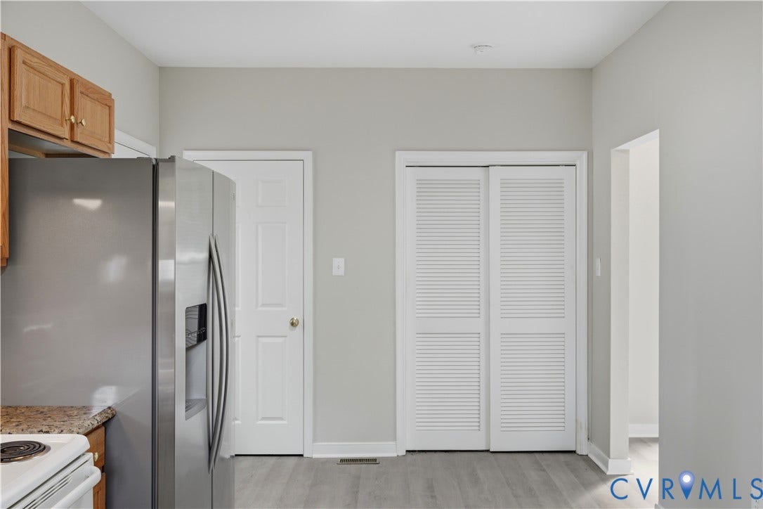 124 Lipscomb Street, Blackwell, Richmond, VA 23224 Wood-finish flooring, light gray walls, white louvered closet doors, and recessed ceiling lighting