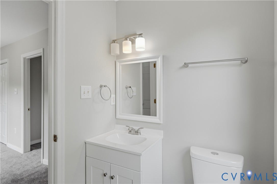 124 Lipscomb Street, Blackwell, Richmond, VA 23224 Vanity with integrated sink, framed mirror, and coordinating lighting fixture