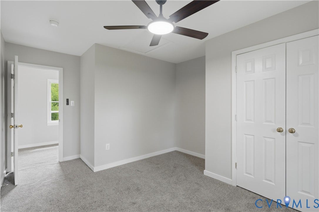 124 Lipscomb Street, Blackwell, Richmond, VA 23224 Plush gray carpeting, white trim, and a ceiling fan with integrated lighting
