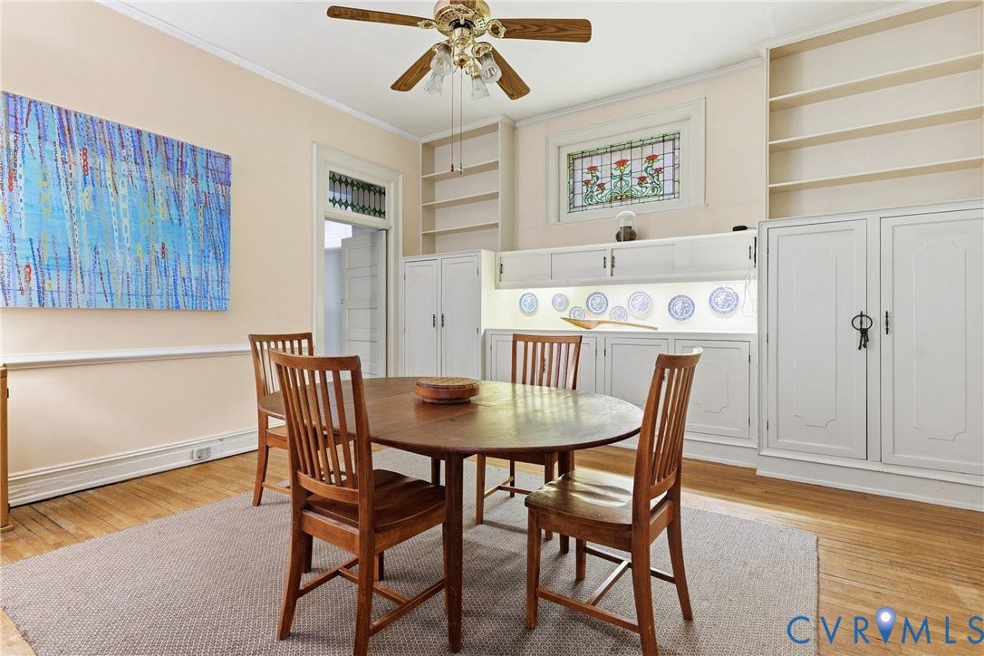 1505 Grove Avenue, Fan, Richmond, VA 23220 Hardwood flooring, built-in shelving, built-in cabinetry, stained glass detail, and a ceiling fan