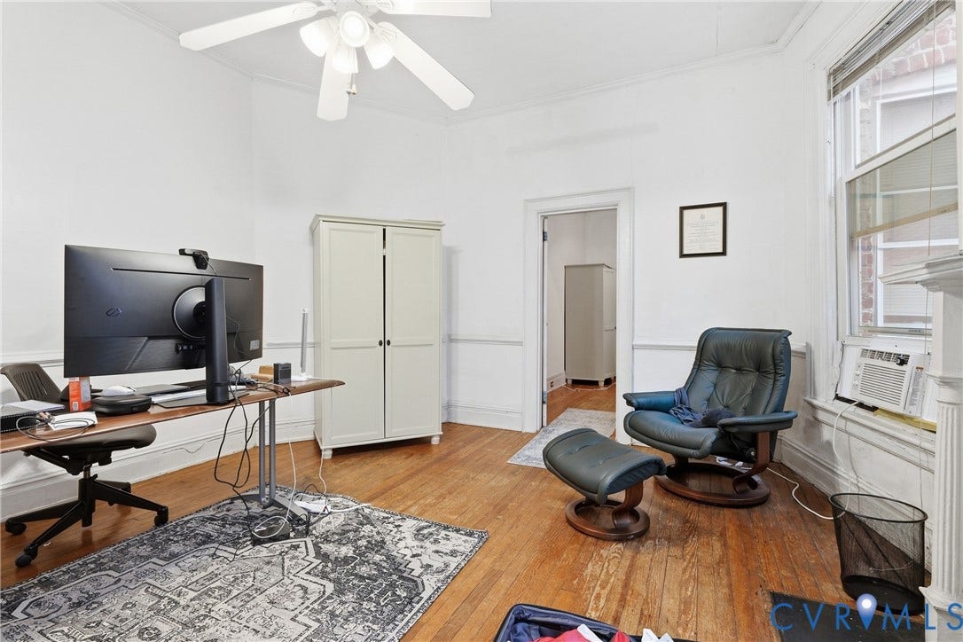 1505 Grove Avenue, Fan, Richmond, VA 23220 Hardwood flooring, painted white walls, ceiling fan, crown molding, and window with trim