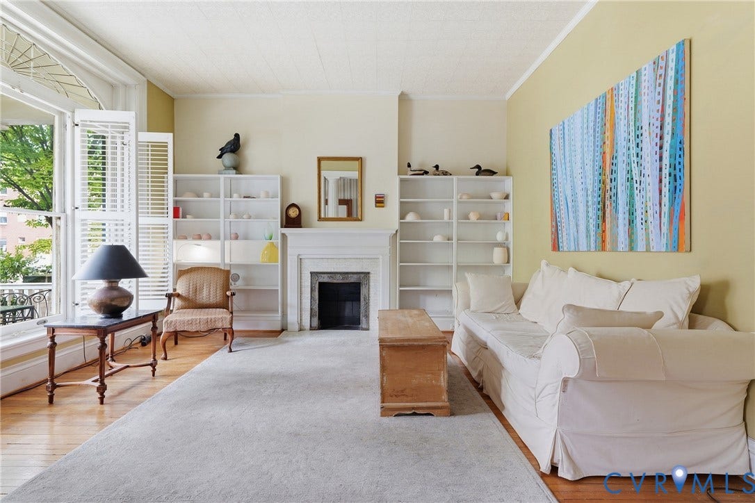 1505 Grove Avenue, Fan, Richmond, VA 23220 Hardwood flooring, decorative fireplace with stone surround, built-in shelving, and balcony access with louvered shutters