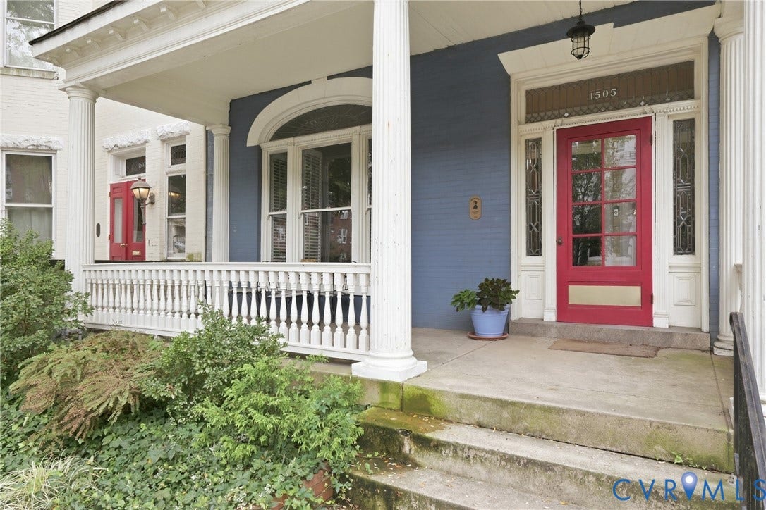 1505 Grove Avenue, Fan, Richmond, VA 23220 Welcoming front porch featuring Doric columns, a vibrant red entry door with transom window, decorative sidelights, and a classic balustrade