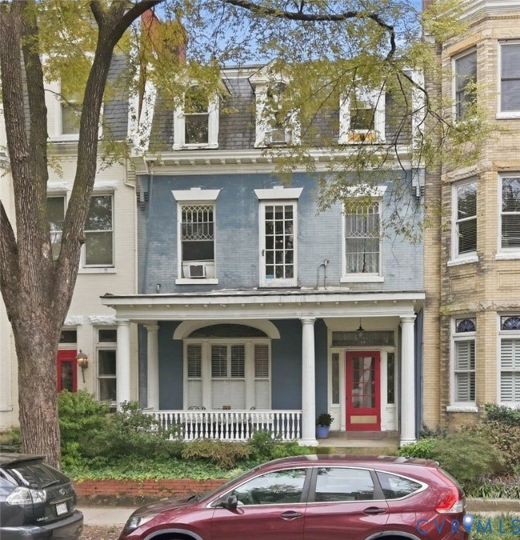 1505 Grove Avenue, Fan, Richmond, VA 23220 Brick facade with a mansard roof, dormer windows, and a covered porch featuring columns and a white railing
