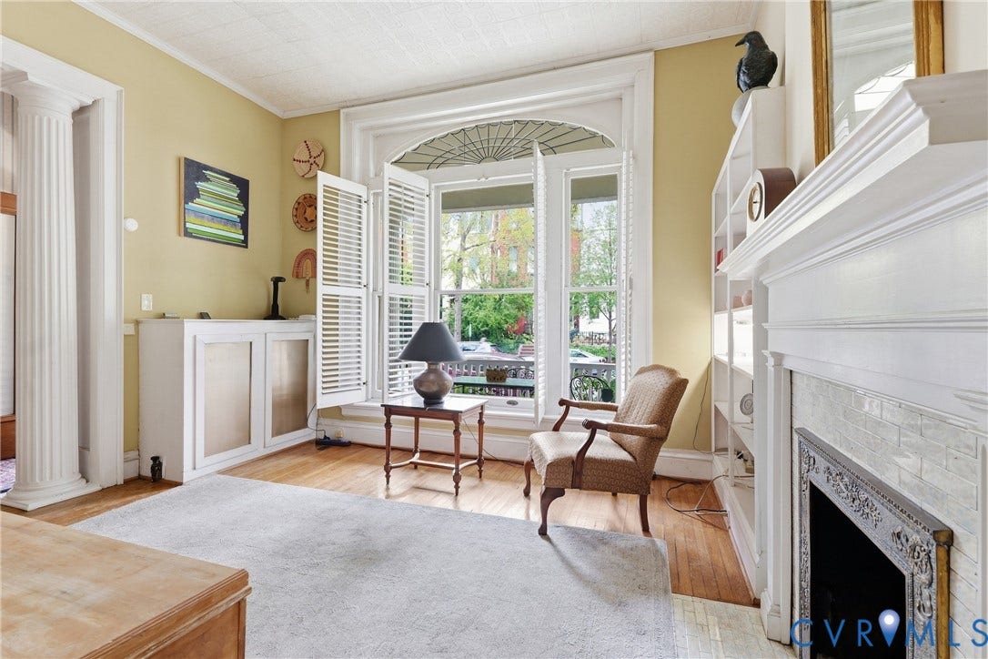 1505 Grove Avenue, Fan, Richmond, VA 23220 Hardwood flooring throughout, built-in cabinetry, custom window shutters, decorative fireplace with tile surround, and an ornate white mantel