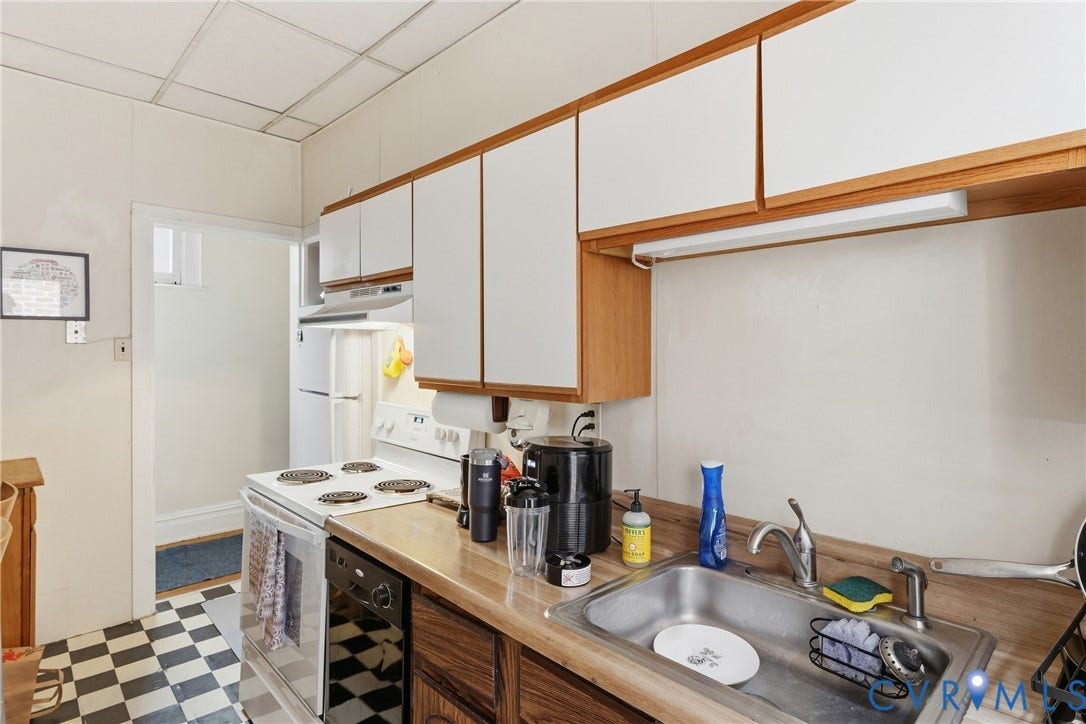 1505 Grove Avenue, Fan, Richmond, VA 23220 Kitchen featuring a stainless steel sink, wood-finish countertops, white cabinetry with wood trim, built-in range, and a dishwasher