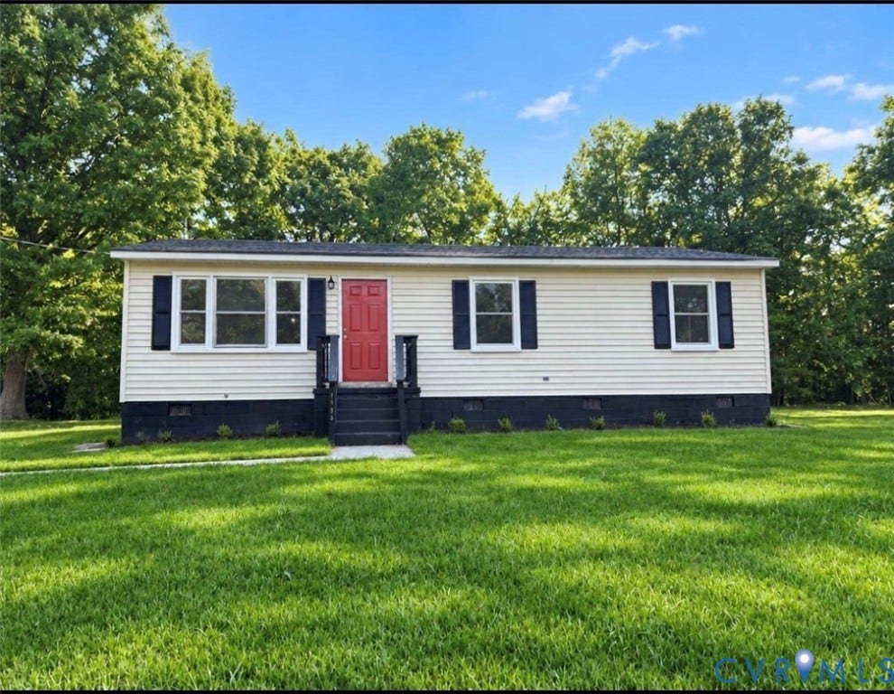 1605 Cartersville Road, Quiet, Goochland, VA 23063 Cream siding exterior with dark blue shutters, a vibrant red entry door, a dark blue porch with steps, and a lush green lawn