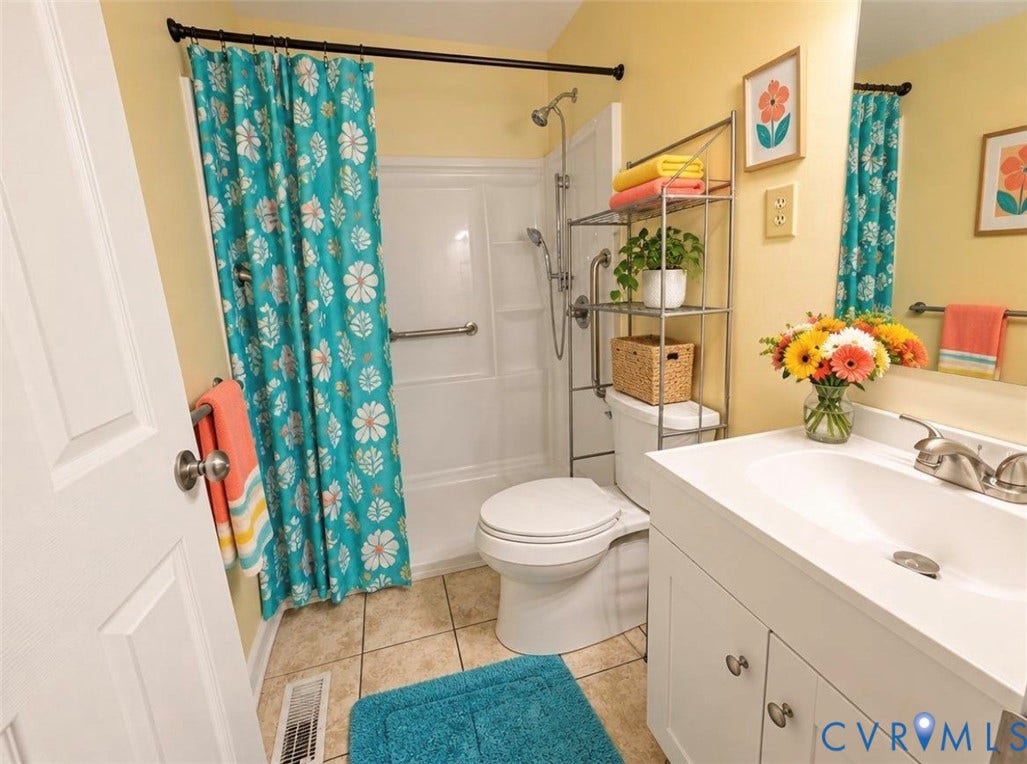1605 Cartersville Road, Quiet, Goochland, VA 23063 VIRTUALLY STAGED: White vanity with a single basin sink, brushed nickel faucet, and integrated countertop