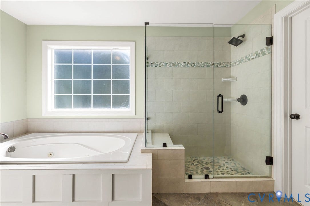 Soaking tub with white paneling