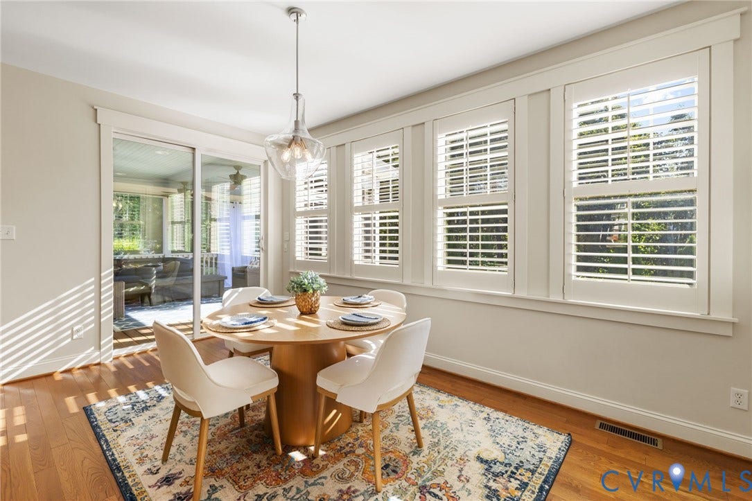 Hardwood flooring complemented by white trim and neutral wall tones