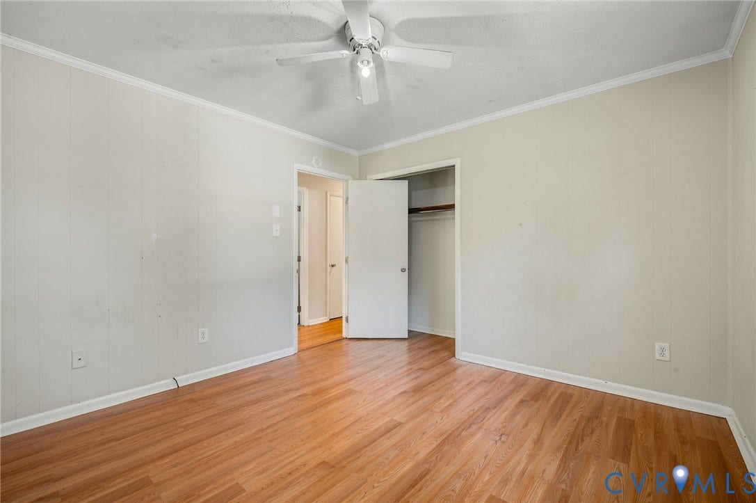 3530 Glisson Road, Richmond, VA 23237 Wood-finish flooring, ceiling fan with integrated lighting, crown molding, and a built-in closet with hanging rod