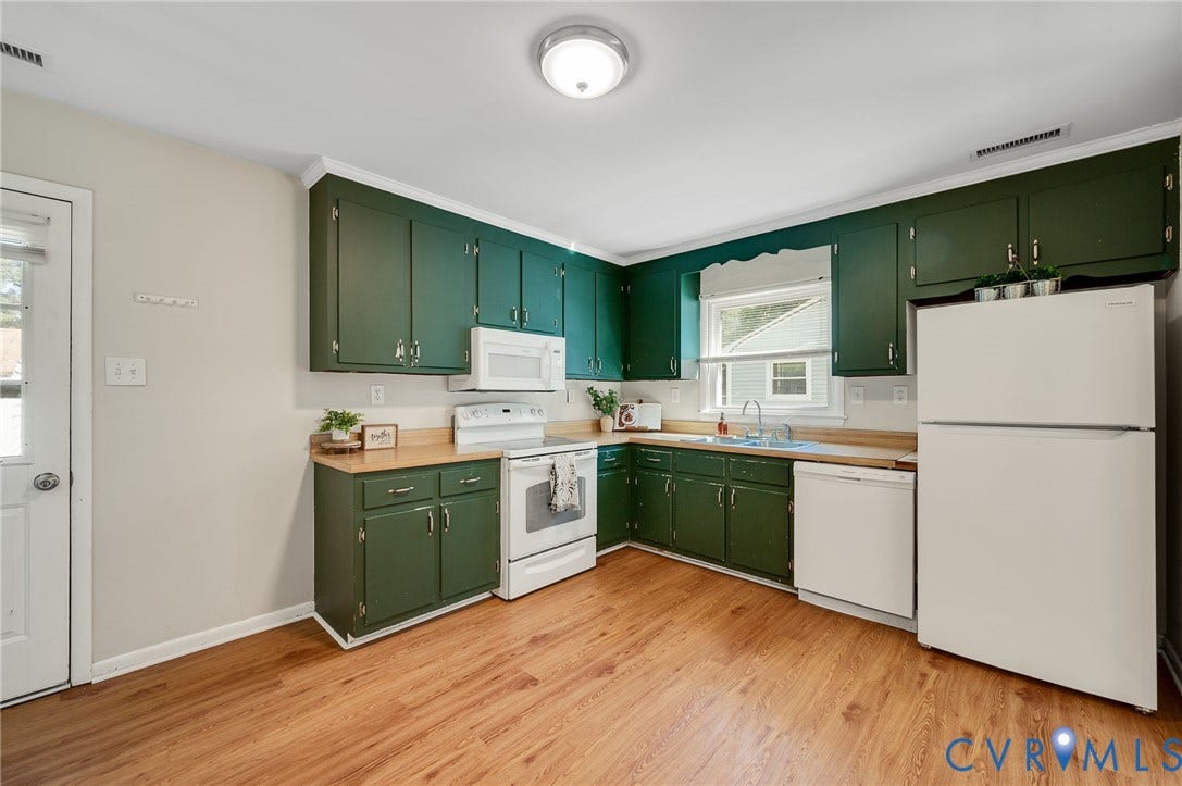 3530 Glisson Road, Richmond, VA 23237 Kitchen featuring abundant green cabinetry, wood-finish countertops, and a full suite of white appliances including a refrigerator, range, and dishwasher