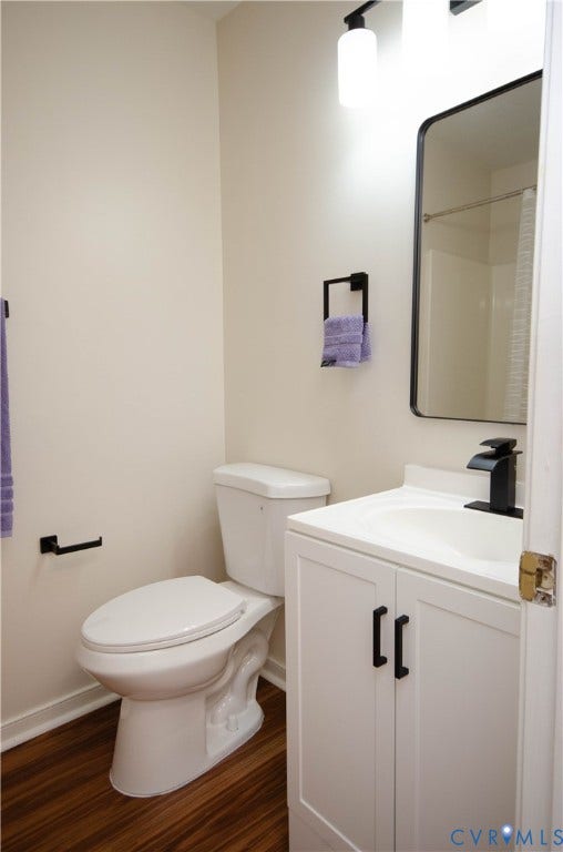 White vanity with matte black hardware, integrated sink, and matte black faucet