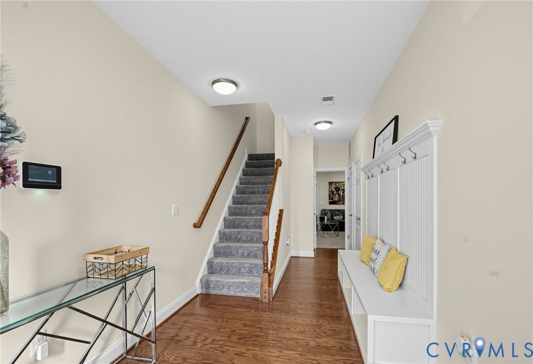 Hardwood-finish flooring throughout the main hallway