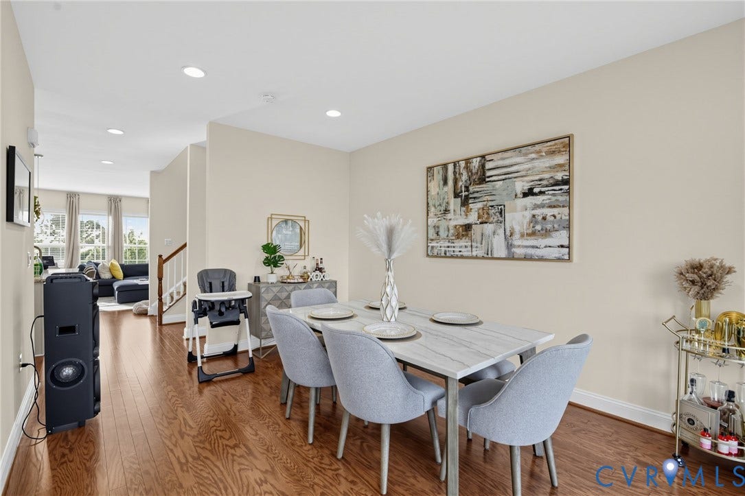 Wood-finish flooring throughout, recessed lighting, and a neutral wall palette