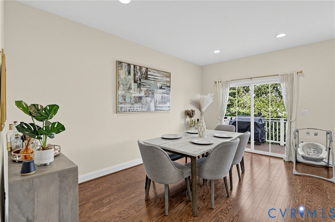 Hardwood flooring, recessed lighting, sliding glass door to exterior, and white trim