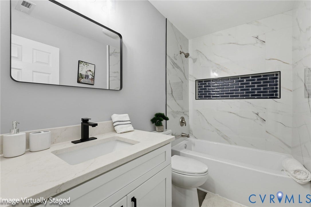 510 N Carolina Avenue, Petersburg, VA 23803 White vanity with a light-colored countertop, rectangular undermount sink, and matte black faucet