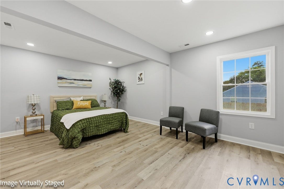 510 N Carolina Avenue, Petersburg, VA 23803 Recessed lighting, wood-finish flooring, and a single pane window with white trim