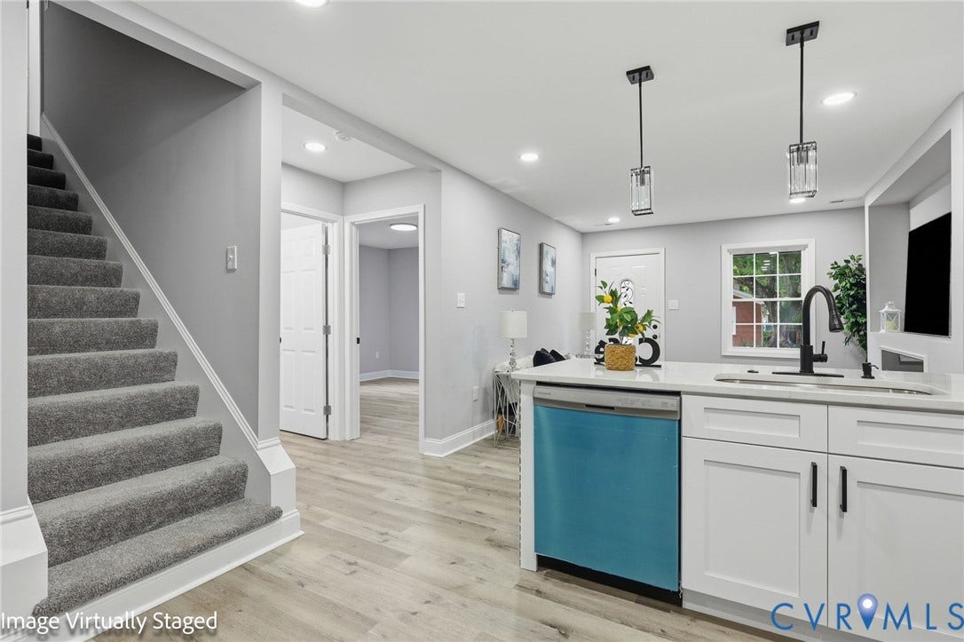510 N Carolina Avenue, Petersburg, VA 23803 White kitchen cabinetry with black hardware, a stainless steel dishwasher, and a black gooseneck faucet