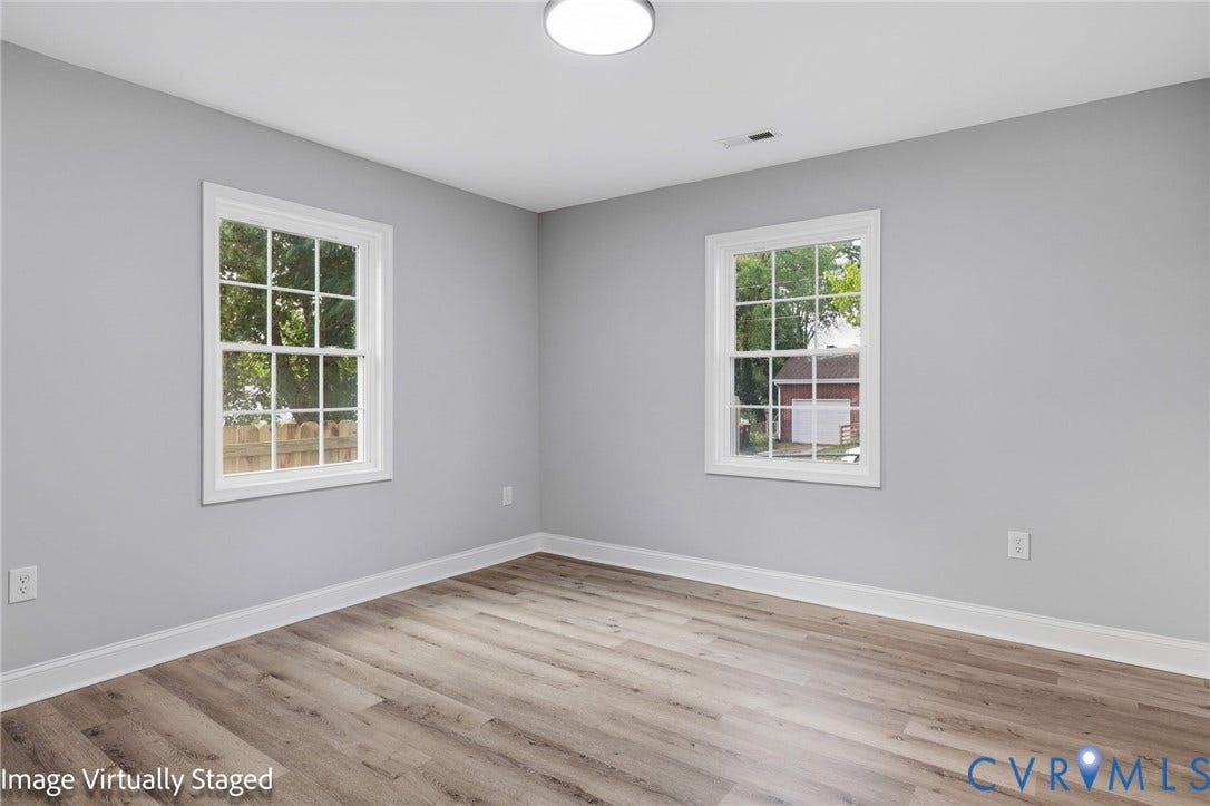 510 N Carolina Avenue, Petersburg, VA 23803 Room featuring two multi-pane windows, wood-finish flooring, and white trim