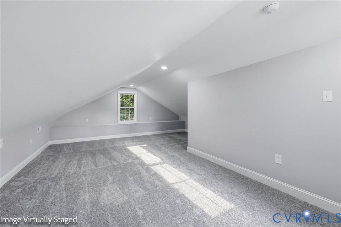 510 N Carolina Avenue, Petersburg, VA 23803 Sloped ceilings with recessed lighting, light gray carpeting, and a white-framed window