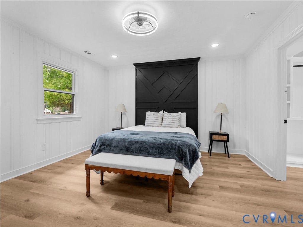 7361 Creekridge Road, Henrico, VA 23231 Wood-finish flooring, white shiplap walls, recessed ceiling lighting, and a contemporary ceiling fan