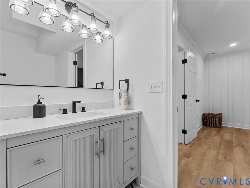 7361 Creekridge Road, Henrico, VA 23231 Vanity with a light-toned countertop, undermount sink, and matte black faucet
