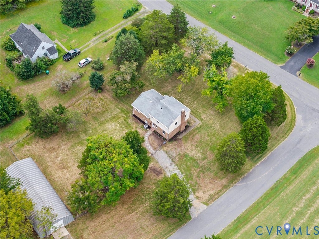 7361 Creekridge Road, Henrico, VA 23231 Expansive corner lot featuring a two-story residence with a light-colored exterior and a prominent chimney