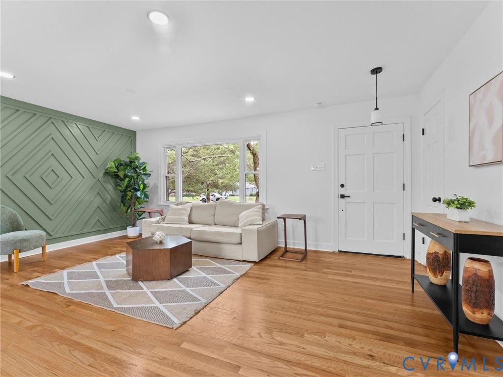 7361 Creekridge Road, Henrico, VA 23231 Hardwood flooring, decorative accent wall, recessed lighting, white paneled door, and a large window