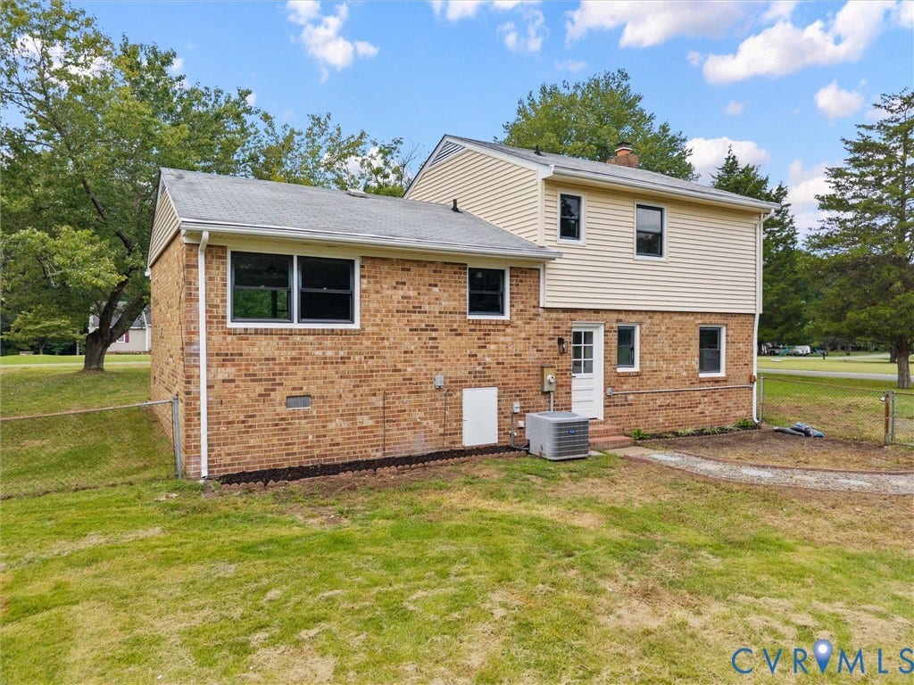 7361 Creekridge Road, Henrico, VA 23231 Brick and siding exterior with multiple windows, a rear entry door, and an exterior air conditioning unit