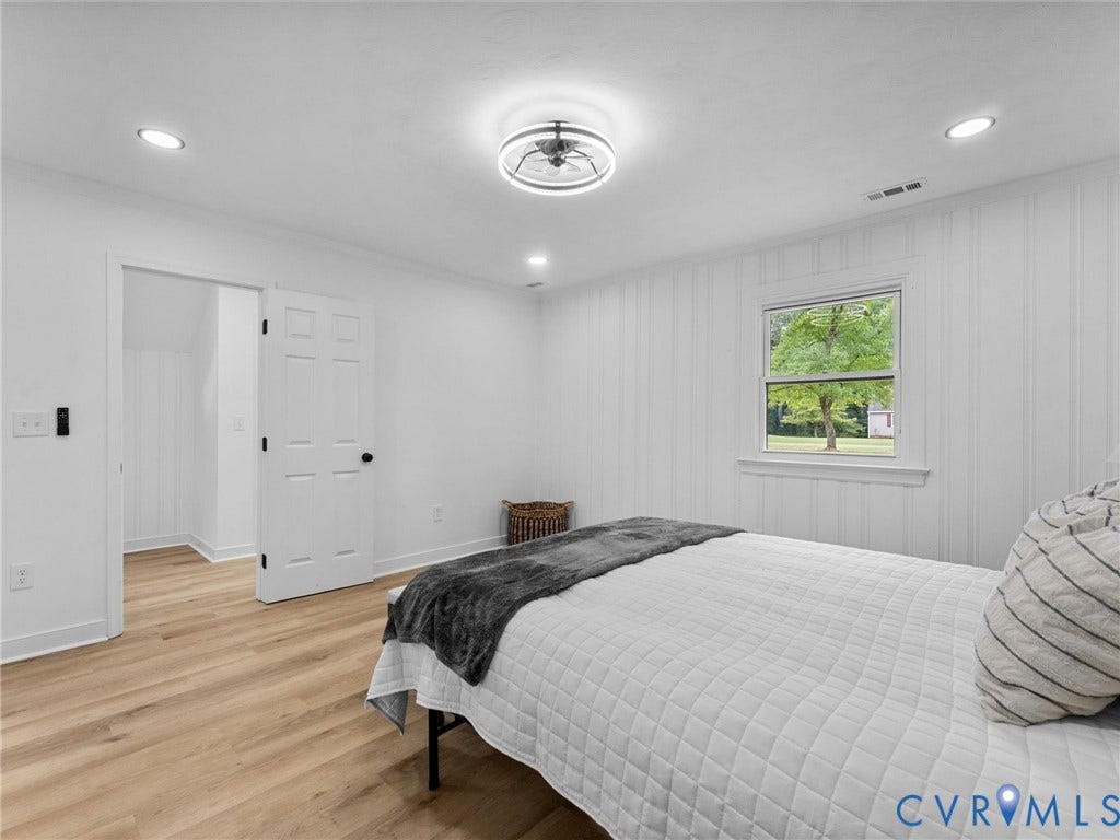 7361 Creekridge Road, Henrico, VA 23231 Wood-finish flooring, recessed lighting, ceiling light fixture, white interior doors, and a window with exterior scenery