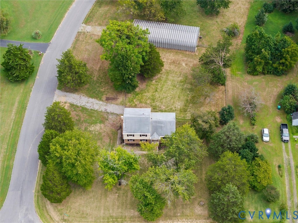 7361 Creekridge Road, Henrico, VA 23231 Expansive property featuring a detached outbuilding, mature trees, and a private gravel driveway
