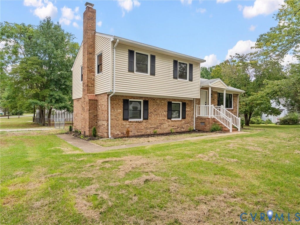 7361 Creekridge Road, Henrico, VA 23231 Brick and siding exterior with a prominent brick chimney